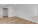 Bright, open-concept living room featuring light wood floors and large, double-door storage at 1422 Hudson Pl, Longmont, CO 80501