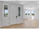 Spacious living room with bright natural light, wood floors, and fresh paint providing a warm, inviting atmosphere at 1422 Hudson Pl, Longmont, CO 80501