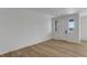 Bright living room featuring hardwood floors, ample natural light, and fresh paint for a move-in ready feel at 1422 Hudson Pl, Longmont, CO 80501