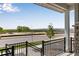 Scenic porch view overlooking a street, new construction and distant greenery under a clear blue sky at 1422 Hudson Pl, Longmont, CO 80501