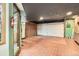Spacious basement with tile flooring, closet and utility access at 11153 W 17Th Ave # 101, Lakewood, CO 80215