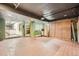 Large finished basement area with tile flooring, storage, and utility access at 11153 W 17Th Ave # 101, Lakewood, CO 80215
