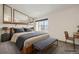 Cozy bedroom with natural light, comfortable bedding, and ample closet space at 11153 W 17Th Ave # 101, Lakewood, CO 80215