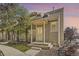 Charming home exterior displaying a covered front porch, neat landscaping, and neutral tones at 11153 W 17Th Ave # 101, Lakewood, CO 80215
