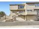 Three story townhouse with multiple car garage, balcony, and neutral exterior paint at 11153 W 17Th Ave # 101, Lakewood, CO 80215