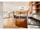 Open concept kitchen and living room space with beautiful hardwood floors and modern finishes at 11153 W 17Th Ave # 101, Lakewood, CO 80215
