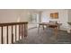 Loft space with wood trimmed windows, neutral carpet and a wood desk at 11153 W 17Th Ave # 101, Lakewood, CO 80215