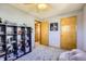 A tidy bedroom boasting wall to wall carpet, gray paint, and natural wood doors at 1065 6Th St, Berthoud, CO 80513