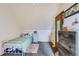Cozy bedroom with a single bed, pink accents, and a mirrored closet door at 1065 6Th St, Berthoud, CO 80513