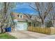 Charming home featuring an attached garage, well-kept lawn, and lovely curb appeal at 1065 6Th St, Berthoud, CO 80513