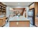 Bright kitchen featuring a large island with granite countertops, stainless steel appliances at 1065 6Th St, Berthoud, CO 80513