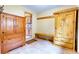 Mudroom entryway with tile flooring, wooden storage cabinets, and a bench at 1176 Raven Ridge Rd, Idaho Springs, CO 80452