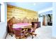 Game room features poker table, wood burning fireplace and tile floors at 1176 Raven Ridge Rd, Idaho Springs, CO 80452