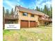 An attached garage offers ample parking and easy access to the main house at 1176 Raven Ridge Rd, Idaho Springs, CO 80452