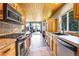 Charming kitchen with wood cabinets, granite countertops, and stainless steel appliances at 1176 Raven Ridge Rd, Idaho Springs, CO 80452