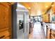 Modern kitchen with stainless steel refrigerator and view to the living room with view windows at 1176 Raven Ridge Rd, Idaho Springs, CO 80452