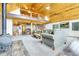 Open living room with wood ceiling and a cozy loft overlooking the main area at 1176 Raven Ridge Rd, Idaho Springs, CO 80452