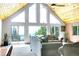 Bright living room with high ceilings, large windows, and scenic mountain views at 1176 Raven Ridge Rd, Idaho Springs, CO 80452