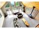 A spacious living room featuring vaulted ceilings, a wood burning stove, and mountain views at 1176 Raven Ridge Rd, Idaho Springs, CO 80452