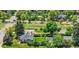 Aerial view of the property showcasing its landscaped yard, mature trees, and neighborhood surroundings at 1901 S Adams St, Denver, CO 80210