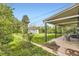 A well-maintained backyard with a large covered patio and a storage shed in the corner at 1901 S Adams St, Denver, CO 80210