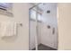 This bathroom is equipped with a glass-doored shower, modern fixtures, and a neutral color scheme at 1901 S Adams St, Denver, CO 80210
