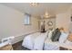 This is a bright bedroom with a clean design, large windows, and a cozy atmosphere at 1901 S Adams St, Denver, CO 80210