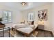 Cozy bedroom features a comfortable bed, stylish decor, and lots of natural light at 1901 S Adams St, Denver, CO 80210