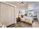 This bedroom features hardwood floors, a closet, and a window for plenty of natural light at 1901 S Adams St, Denver, CO 80210