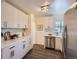 Modern kitchen features stainless steel appliances and bright white cabinetry at 1901 S Adams St, Denver, CO 80210