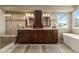 Elegant bathroom with double vanity, soaking tub, and walk-in shower at 8932 Tuscany Ln, Highlands Ranch, CO 80130