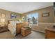 Charming bedroom with a wood bed frame and window views at 8932 Tuscany Ln, Highlands Ranch, CO 80130