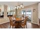 Bright dining area with wooden table and chairs near sliding glass door at 8932 Tuscany Ln, Highlands Ranch, CO 80130