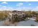 Two-story home with large deck and snowy backyard, aerial view at 8932 Tuscany Ln, Highlands Ranch, CO 80130