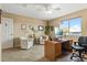 Home office with two chairs, desk, and window views at 8932 Tuscany Ln, Highlands Ranch, CO 80130