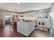 Spacious kitchen with island, stainless steel appliances, and white cabinets at 8932 Tuscany Ln, Highlands Ranch, CO 80130