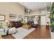 Large living room with hardwood floors, high ceilings and an open floor plan at 8932 Tuscany Ln, Highlands Ranch, CO 80130