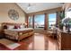 Large main bedroom with hardwood floors and view at 8932 Tuscany Ln, Highlands Ranch, CO 80130