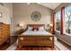 Main bedroom with hardwood floors and large windows at 8932 Tuscany Ln, Highlands Ranch, CO 80130