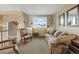 Cozy sitting area with built-in shelving and comfortable seating at 8932 Tuscany Ln, Highlands Ranch, CO 80130