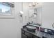 Bright bathroom with modern vessel sink and vanity, and ample lighting at 728 N Ogden St, Denver, CO 80218