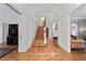 Elegant foyer featuring hardwood floors, staircase, and arched doorways, creating a welcoming entrance at 728 N Ogden St, Denver, CO 80218