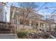 Elegant home with a spacious front porch, a stone wall, and iron fencing enhances its curb appeal at 728 N Ogden St, Denver, CO 80218