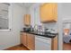 Efficient kitchen space featuring stainless steel appliances, dark countertops, and ample storage at 728 N Ogden St, Denver, CO 80218