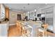 Gourmet kitchen with stainless steel appliances, granite countertops, and island seating at 728 N Ogden St, Denver, CO 80218
