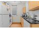 Bright kitchen features stainless steel appliances, granite counter tops, and a window view at 728 N Ogden St, Denver, CO 80218