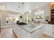 Bright kitchen with a large island, granite countertops, and modern appliances at 728 N Ogden St, Denver, CO 80218