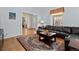 Living room featuring hardwood floors, a leather sofa, and a view into another room at 728 N Ogden St, Denver, CO 80218