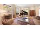 Comfortable living room with a fireplace, piano, and window seating at 728 N Ogden St, Denver, CO 80218