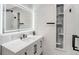 Modern bathroom featuring sleek vanity with marble countertop and walk-in shower at 3437 N Jackson St, Denver, CO 80205